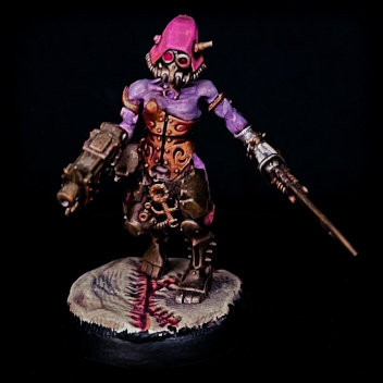 a warhammer model that was custom build from parts of the skitarii and the daemonette kits. it is wearing a pink hood, a half feminine half masculine upper body with lavender skin, wearing bronze armour that leaves the arms, neck and cleavage exposed. it's wearing black pants but it's lower legs are fully mechanical. it wields a sword and a pistol, and walks on a surface that looks like bloody skin that was cut and then sewn back together.